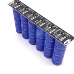 How does a capacitor differ from a battery?